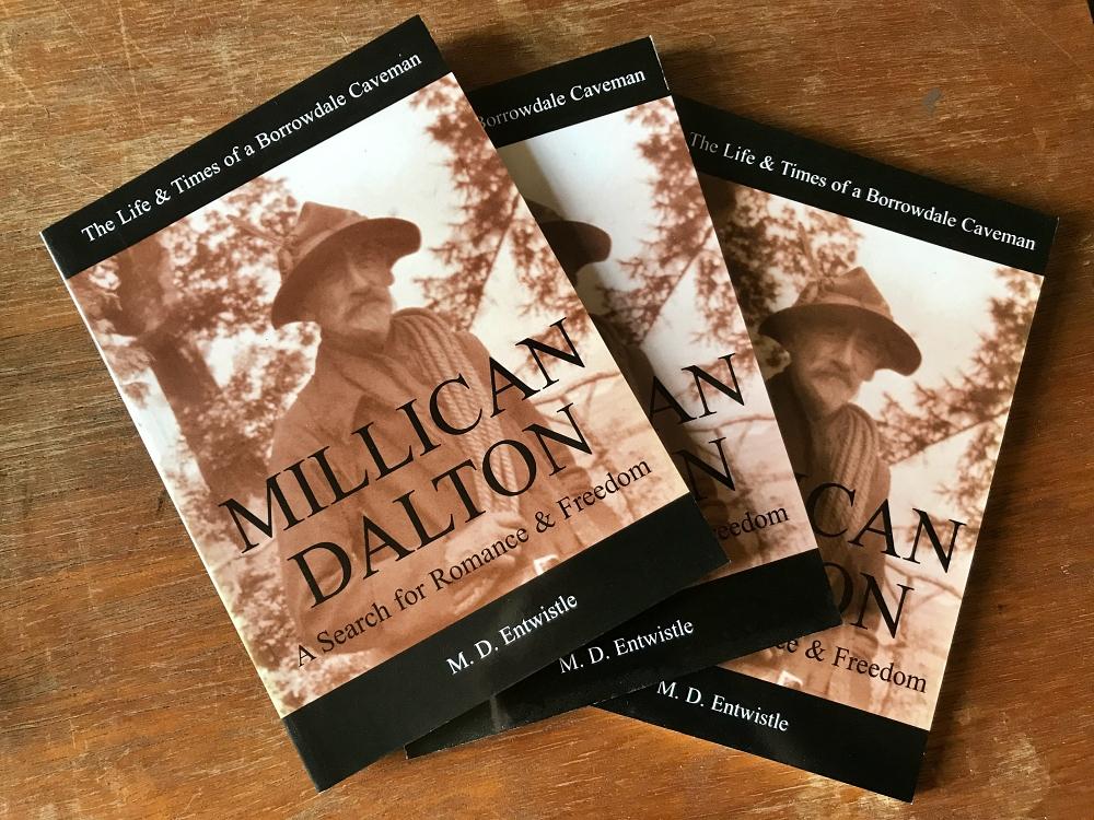3 copies of Millican Dalton book on a wooden trunk
