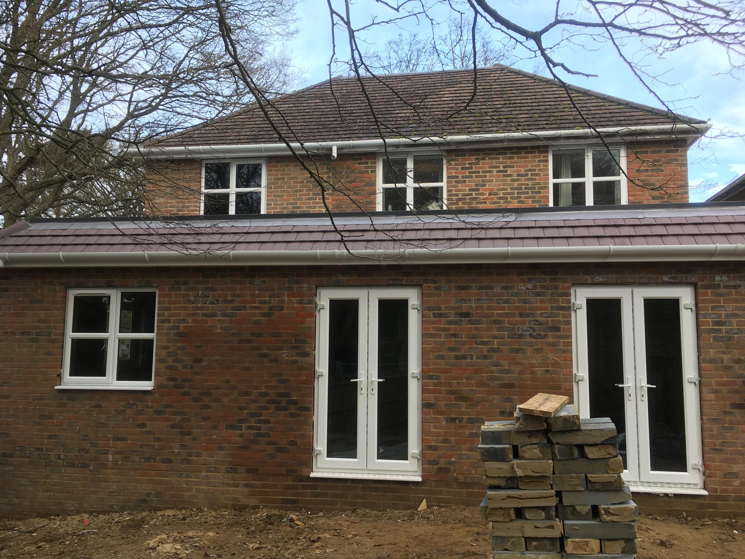 White upvc windows and double doors installed to this small development