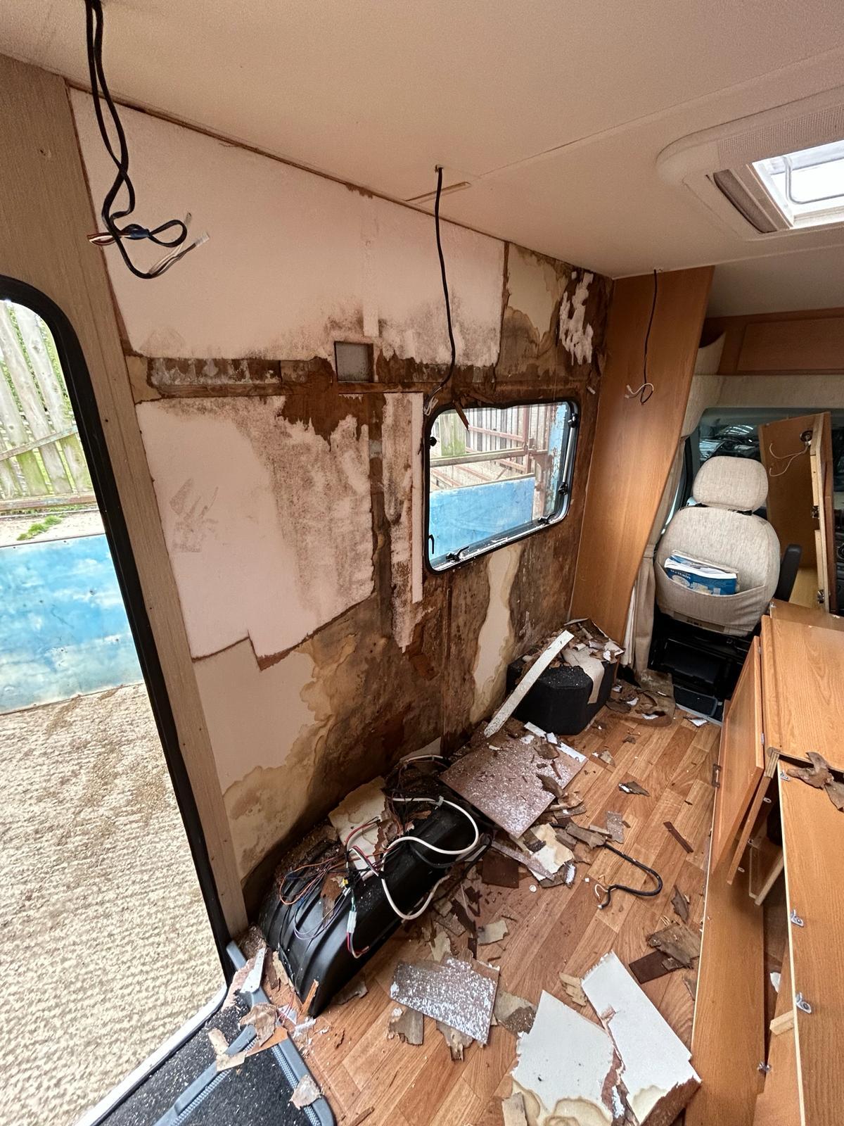 Damp damage in kitchen area of a caravan