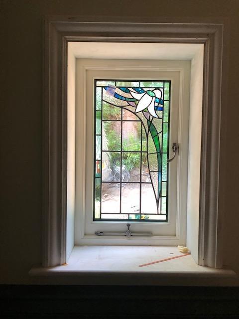 This artisan created lead work was sandwiched between glass to create a snug double glazed unit