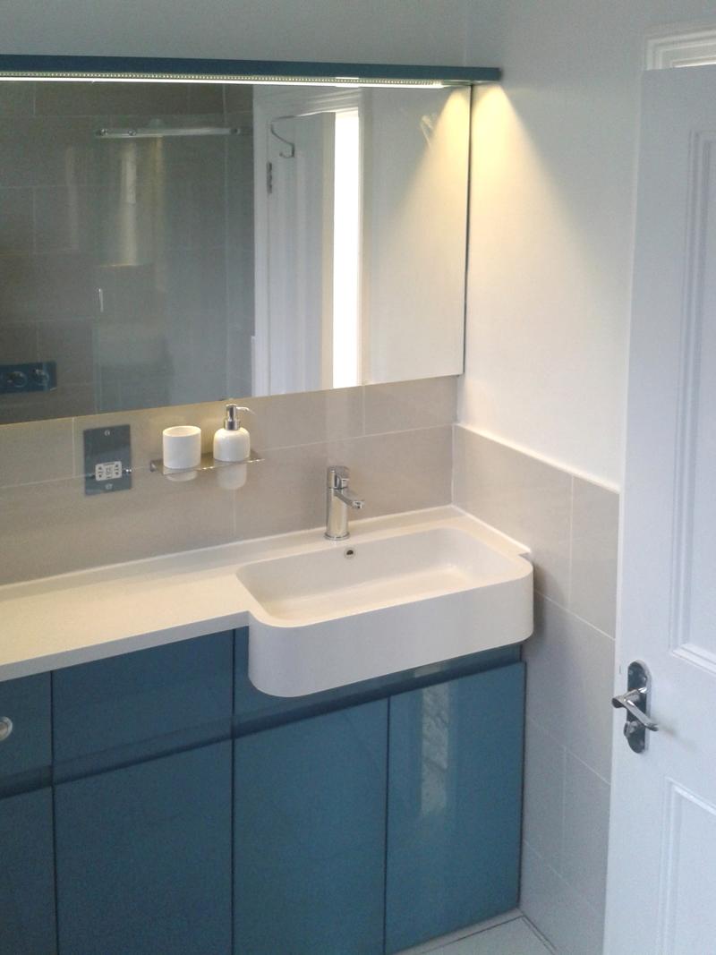 Blue and grey bathroom with white sink