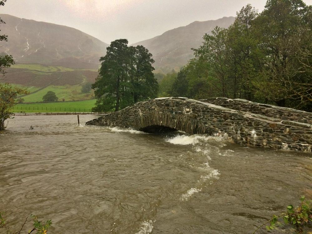 New Bridge in Borrowdale surrounded by floodwater from the River Derwent