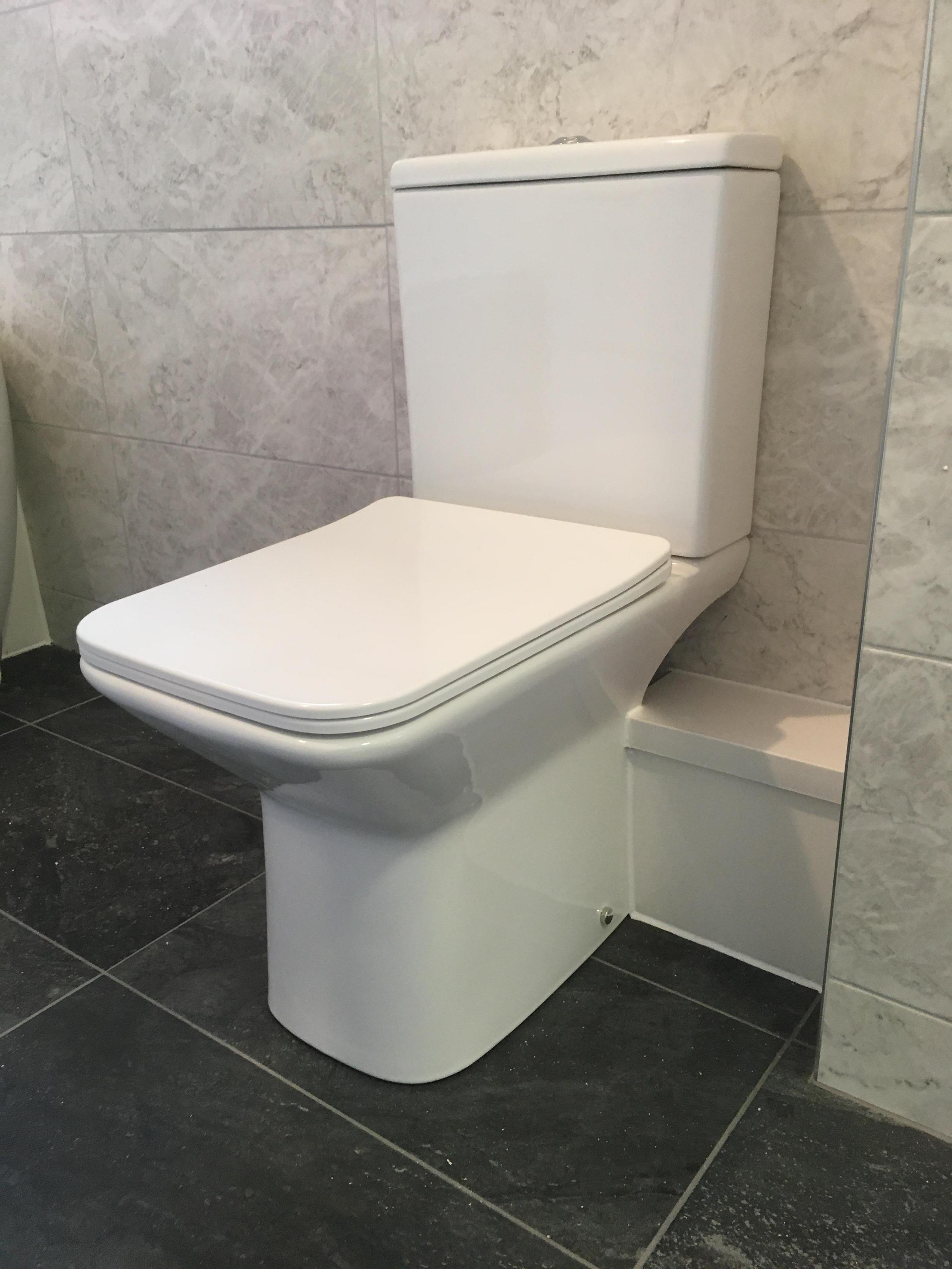 slim line close coupled toilet in new bathroom