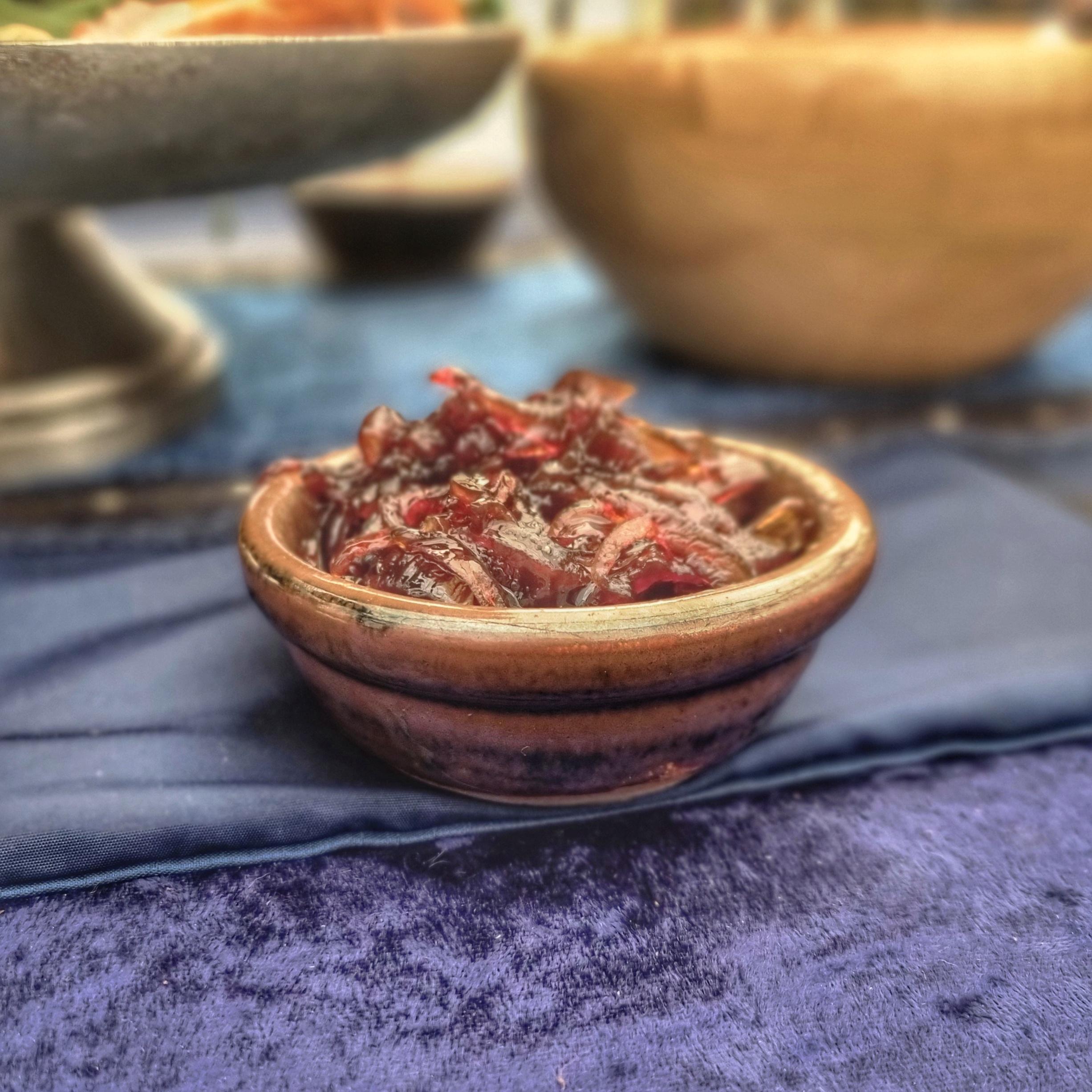 Mini Earthenware dish, here filled with red onion chutney. On blue tablecloth and runner