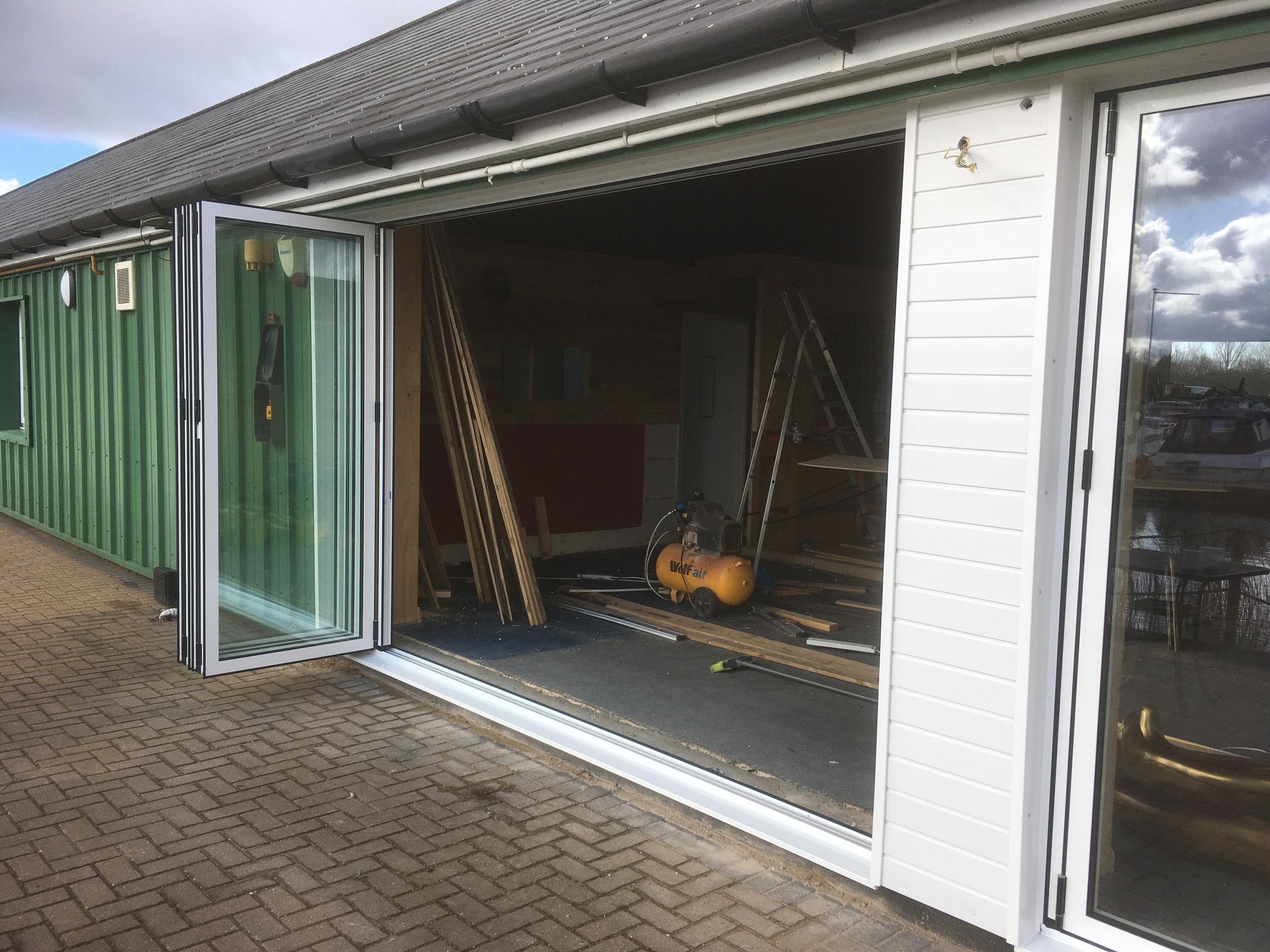 Completion of the 2 bifold doors with cladding to cover the supporting pier