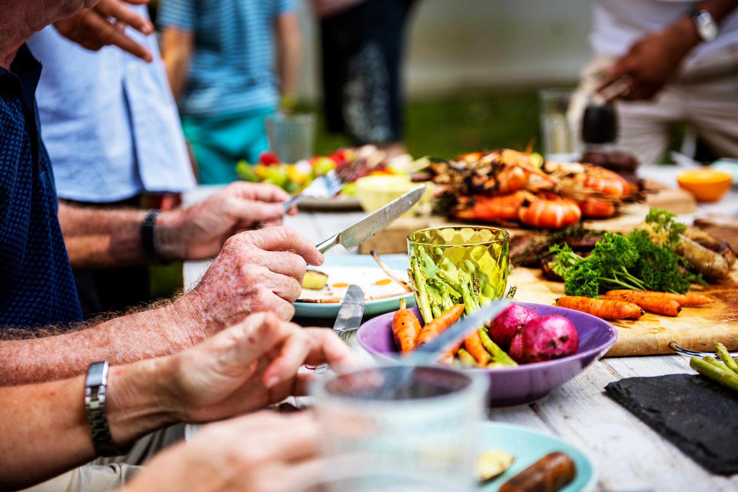 <a href="https://www.freepik.com/free-photo/closeup-diverse-people-enjoying-barbecue-party-together_2861347.htm#query=eating&position=35&from_view=search&track=sph">Image by rawpixel.com</a> on Freepik
