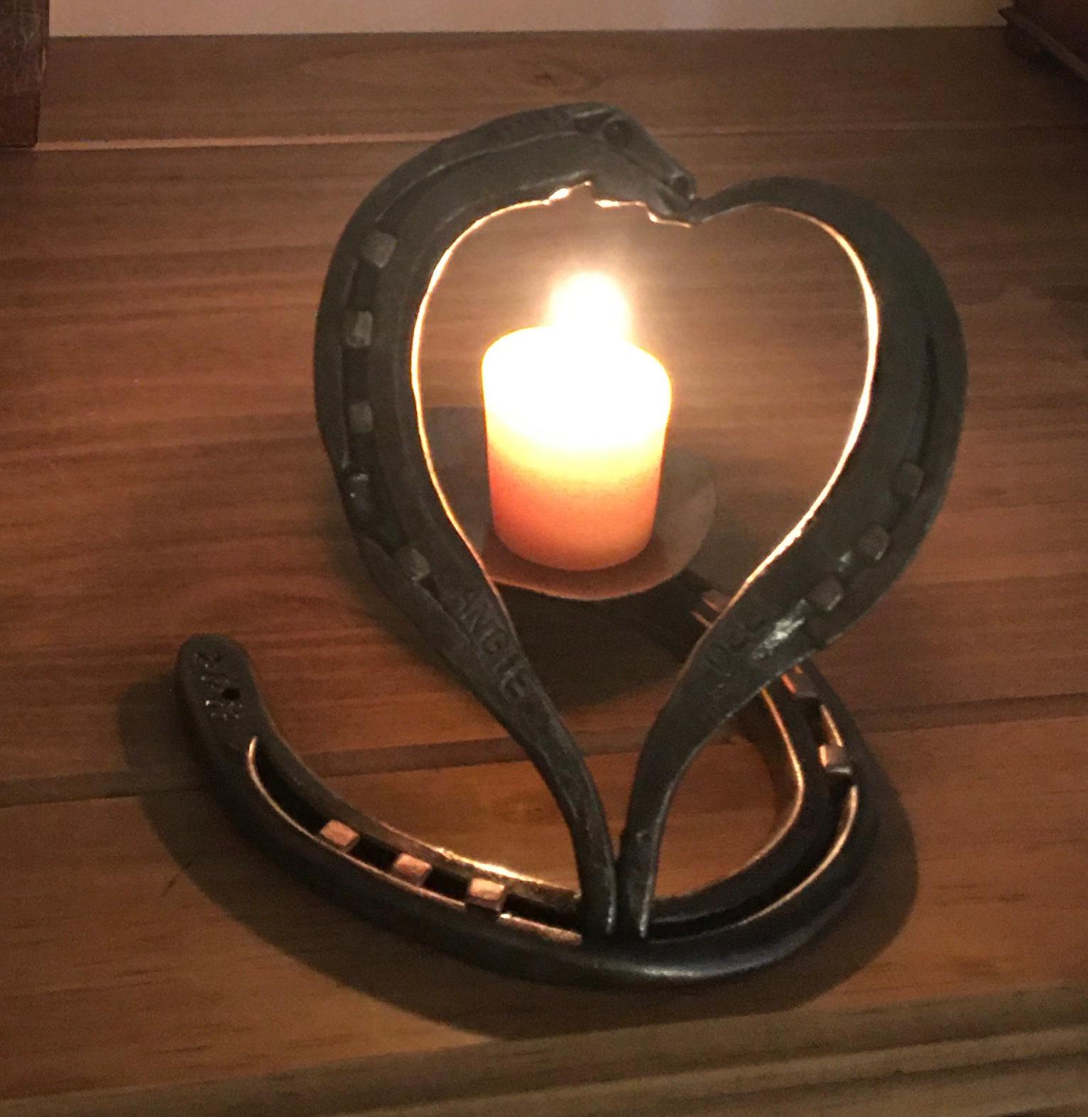 Candle light on a Birthday horse shoe art .