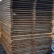 stack of pressure treated 6ft x 4ft fence panels