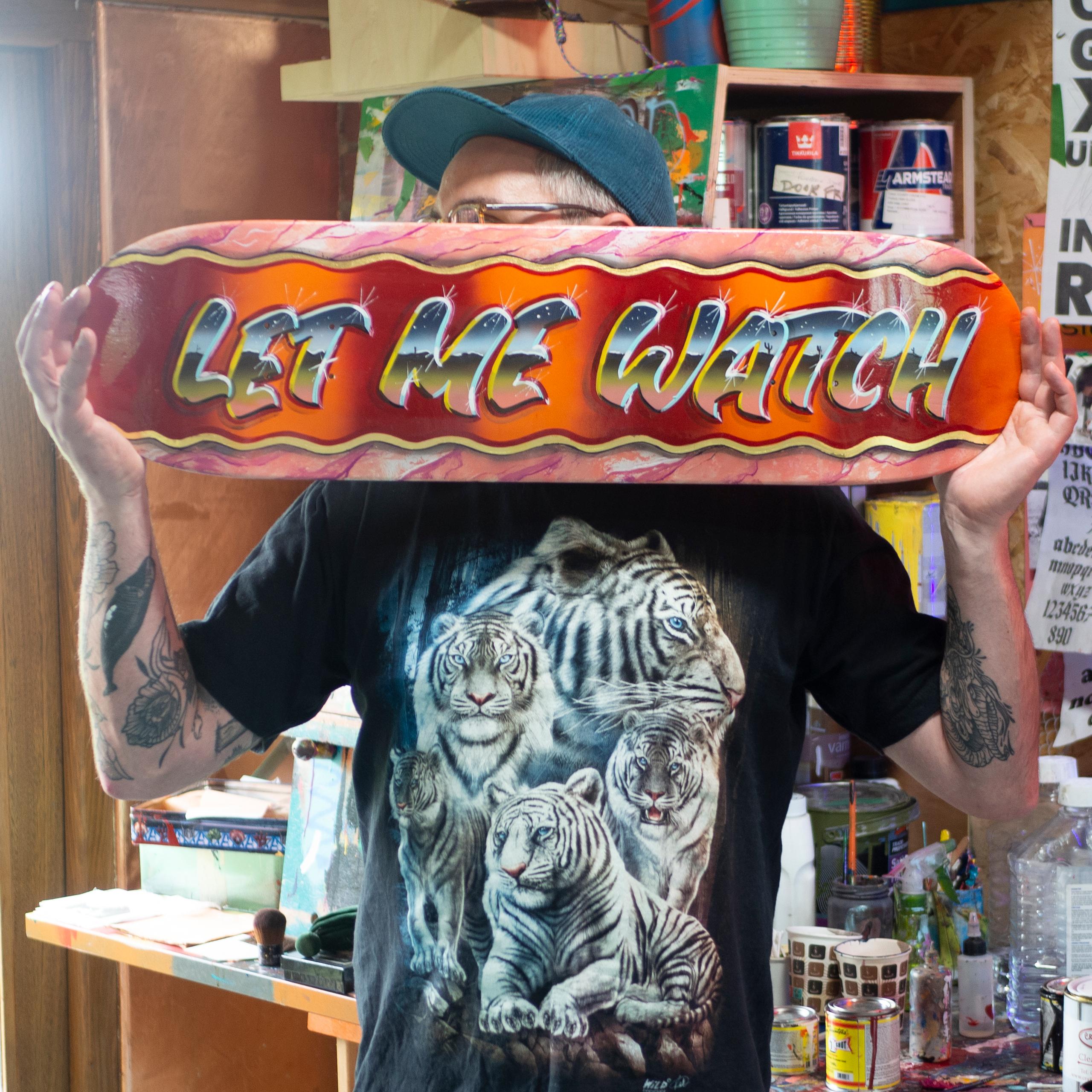 'LET ME WATCH' painted skateboard