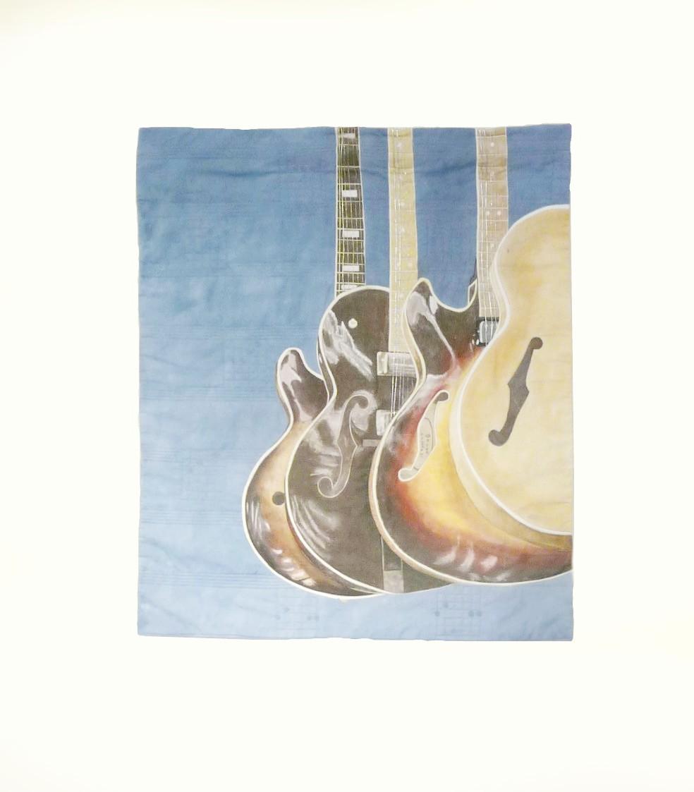 wholeclothe painted art quilt. Machine quilting & metallic cords for the guitar strings. 52 x 62cm
