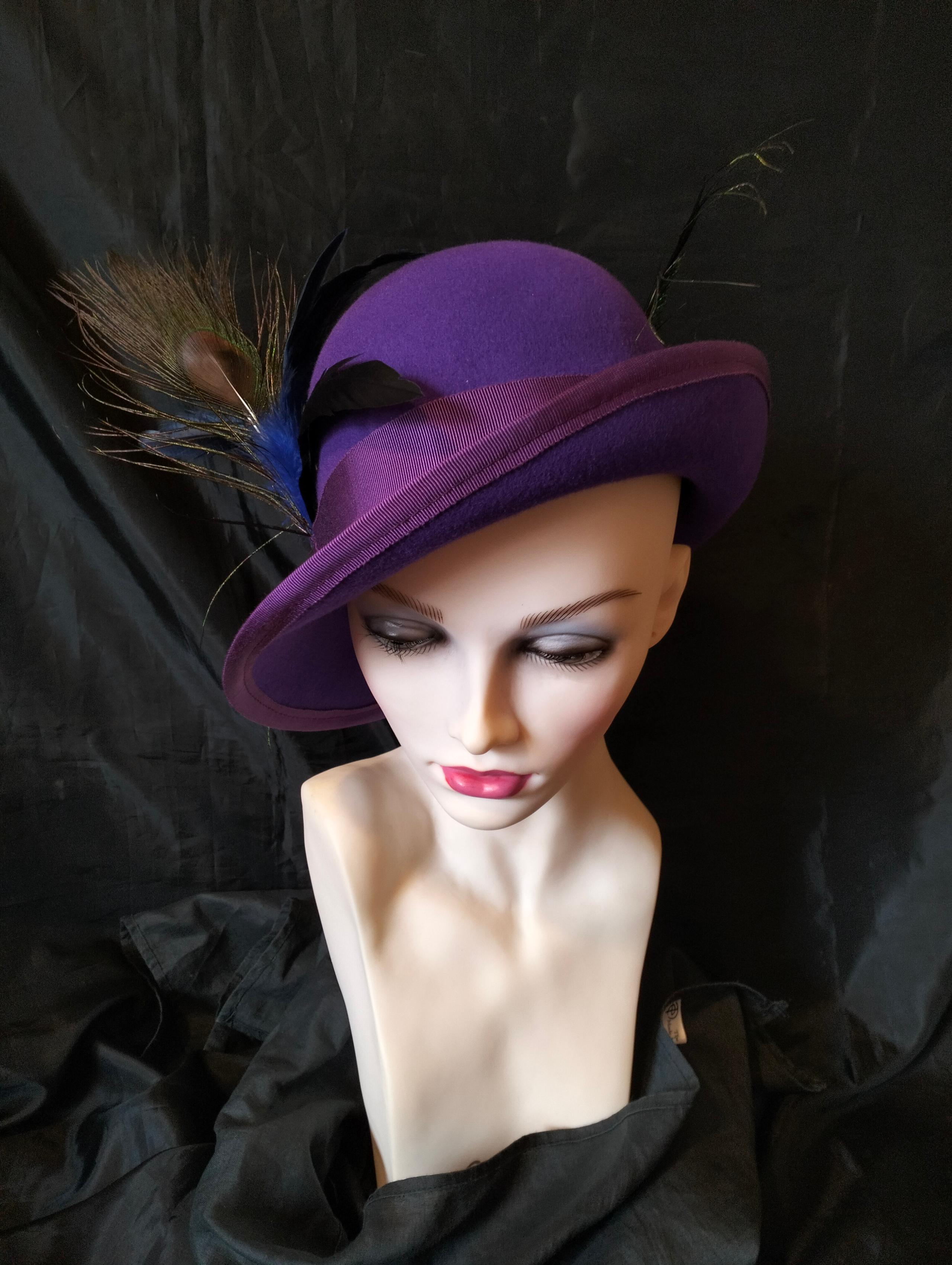 Softly hand blocked from royal purple wool felt, this  hat is so reminiscent of the 1920's.