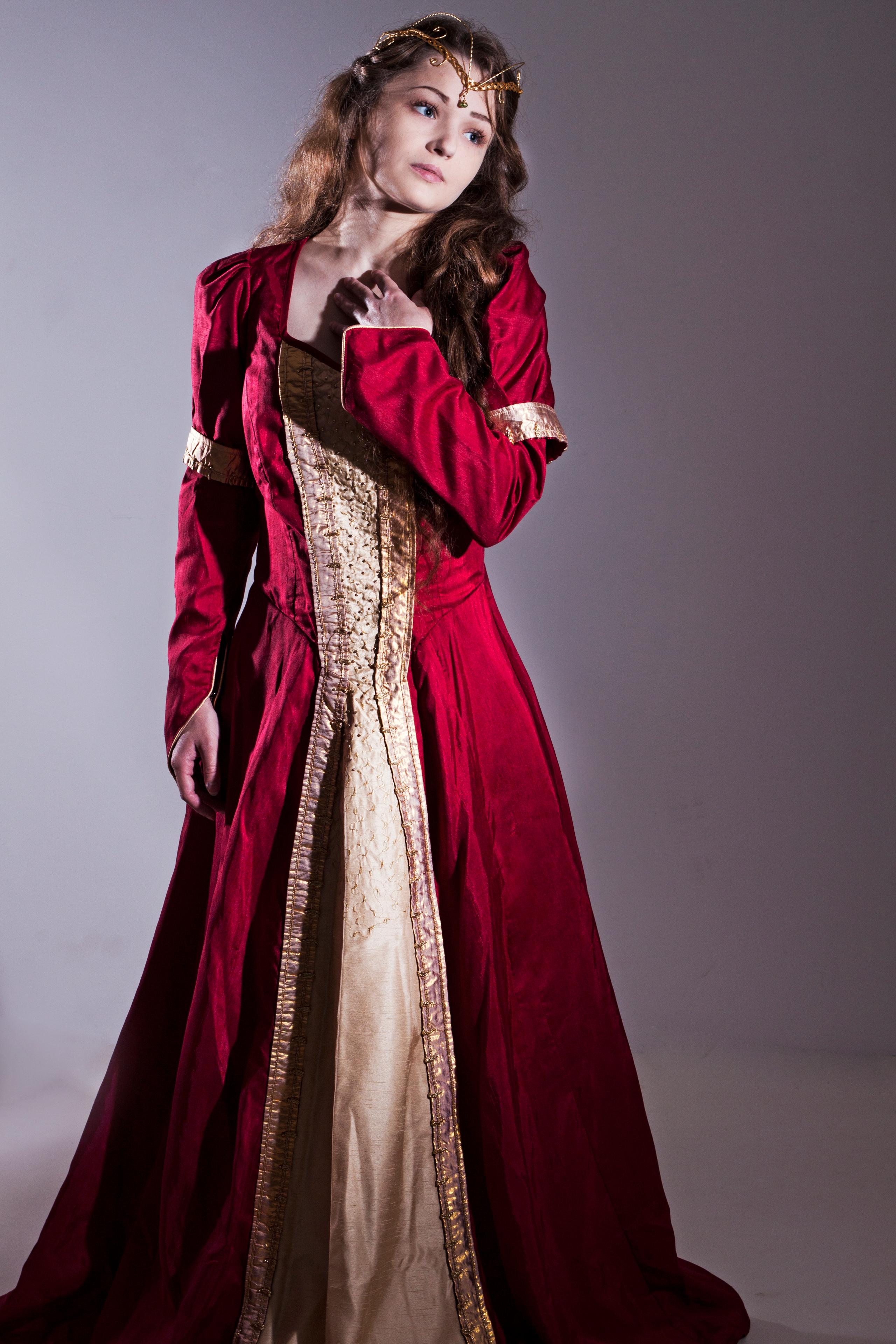 red medieval gown with lighter front panel. Embroidered and beaded