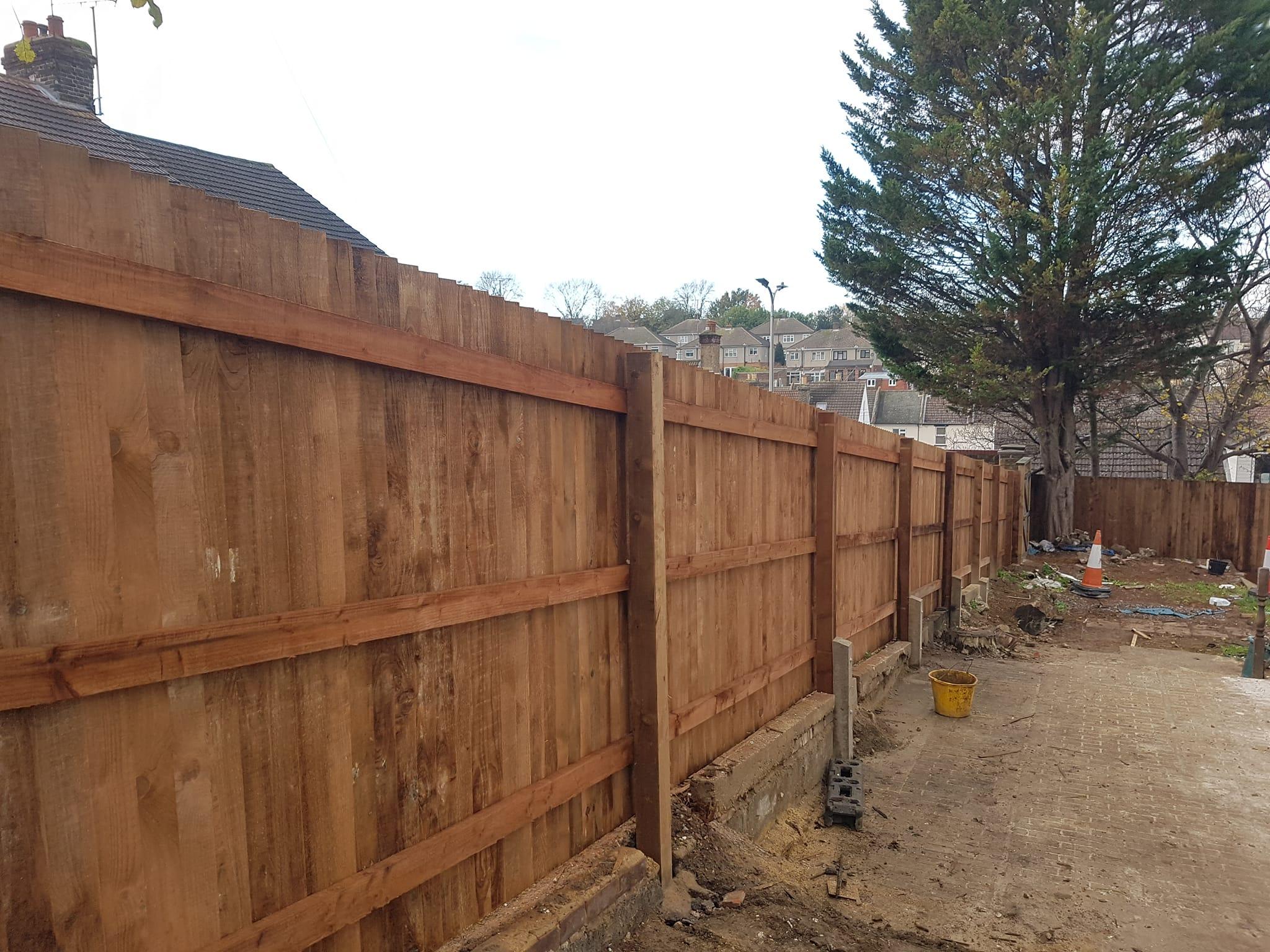 but with the rails connected to the front of the posts.fencing installed in Chatham