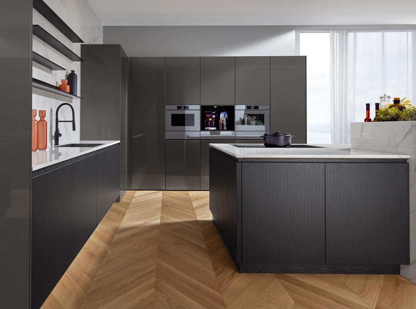 Contemporary style kitchen with push to open doors and L shaped recess handle