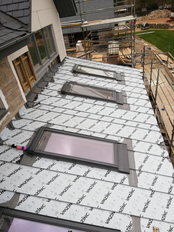 Zinc roof cladding in progress.