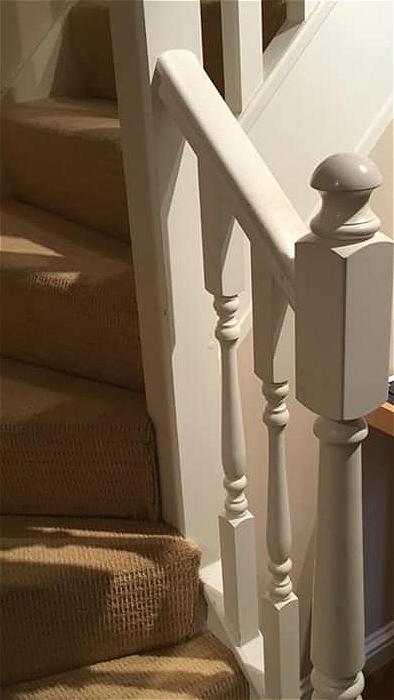 Wooden stair banister before refurbishment.