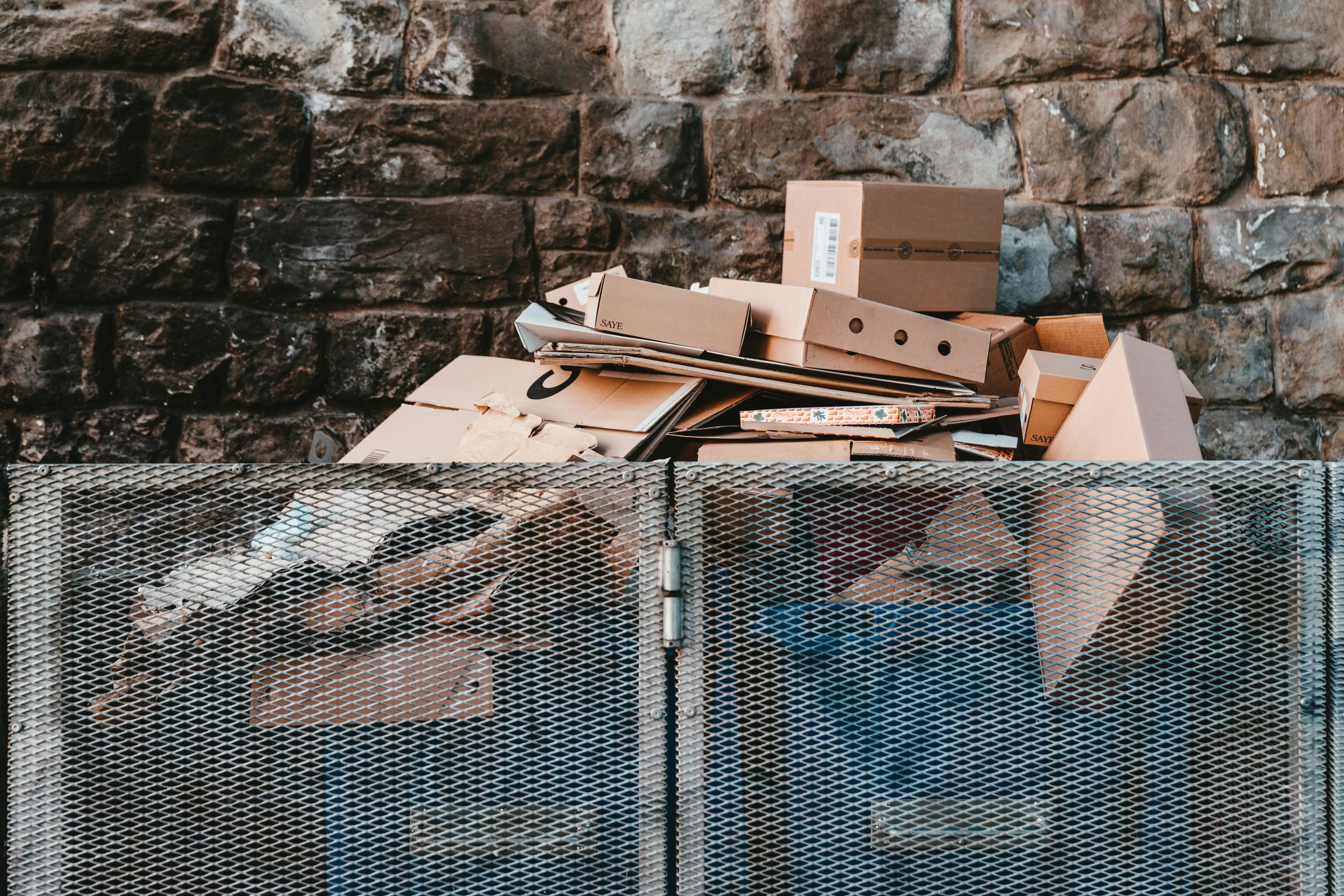 A picture of boxes stacked in a cage