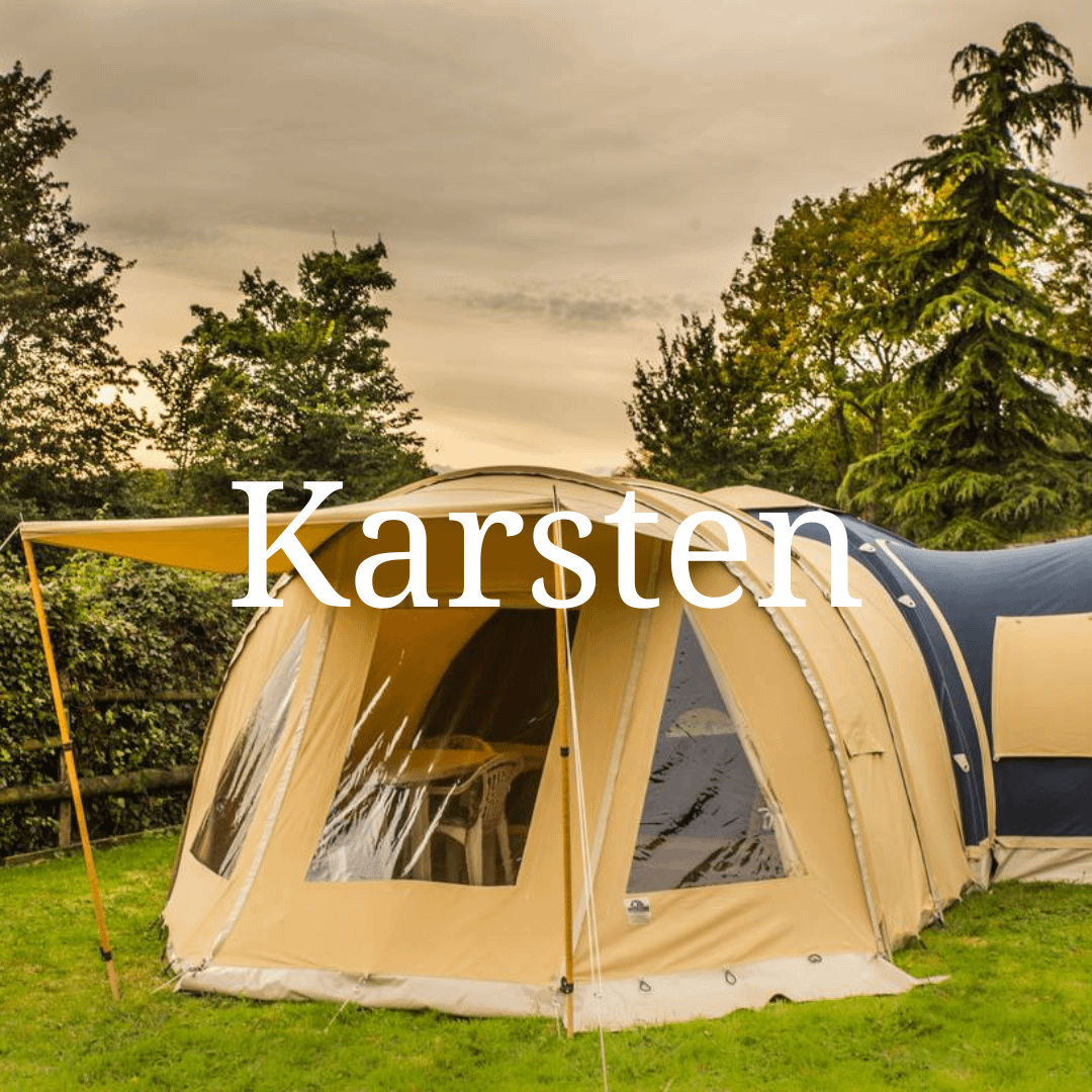 Karsten Tent with Awnings and sleeping extension pitched in a field