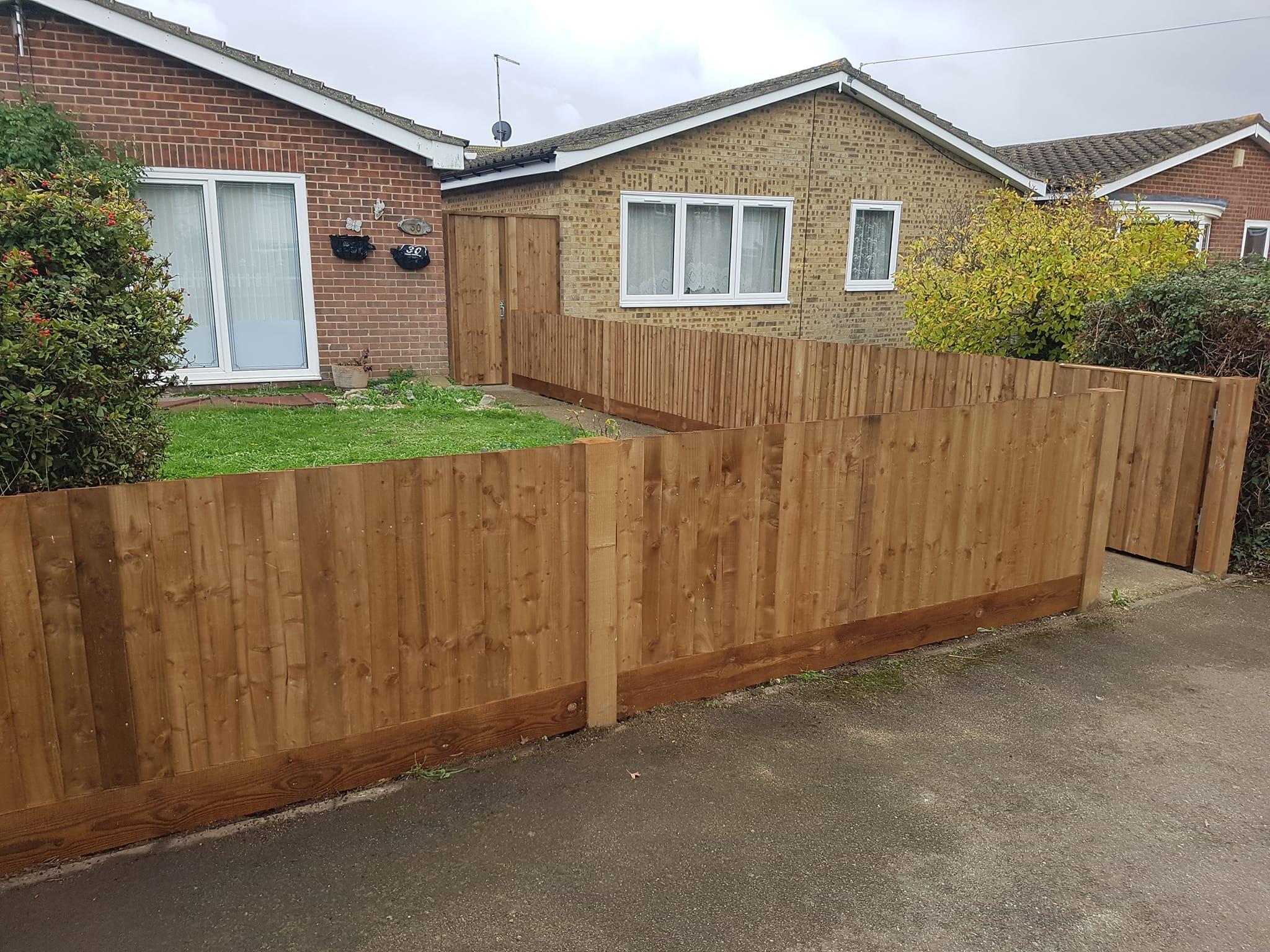 Closeboarding with a matching gate.  Fencing installed in Isle of grain