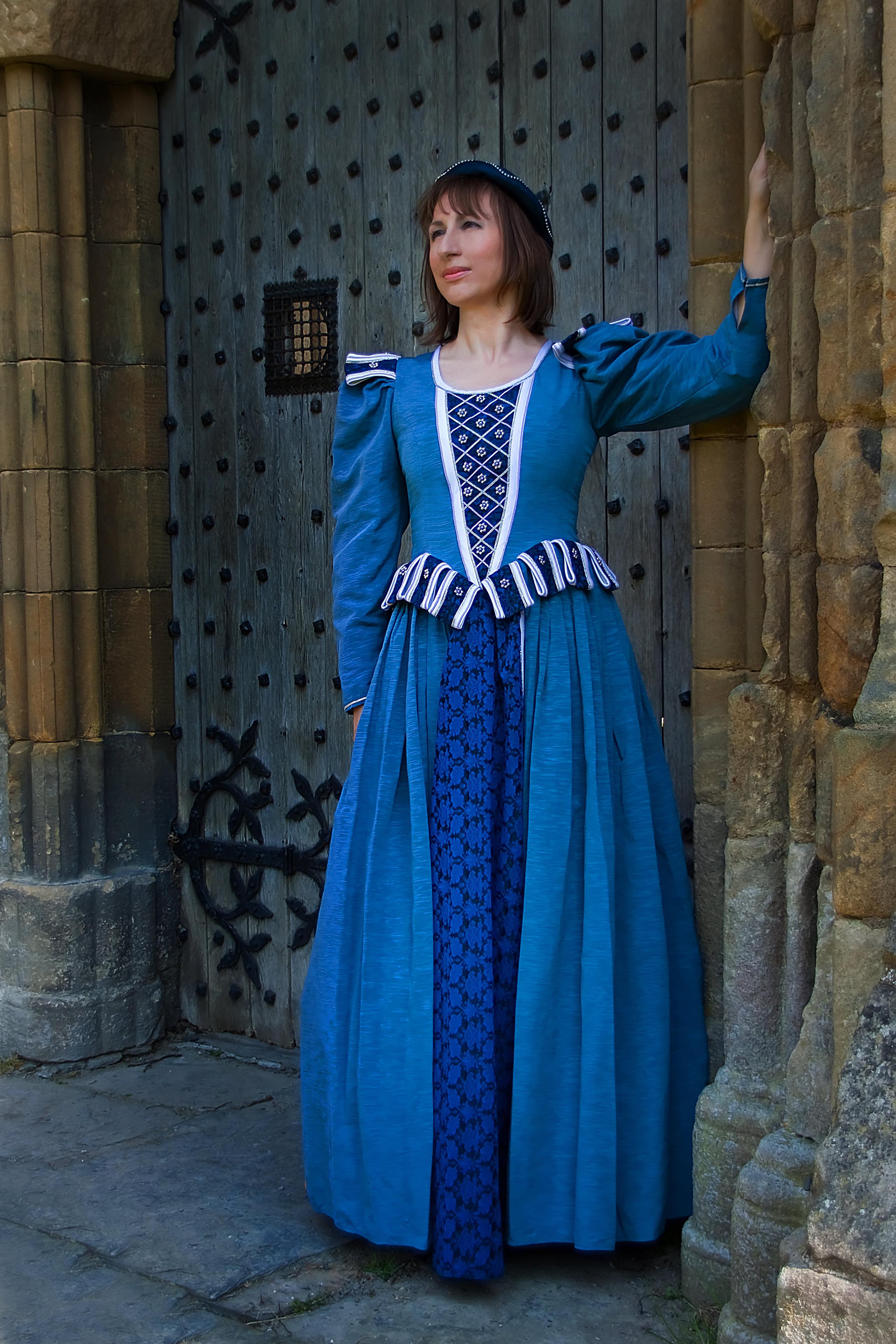 blue medieval gown. contrast in heavy brocade with white pipping