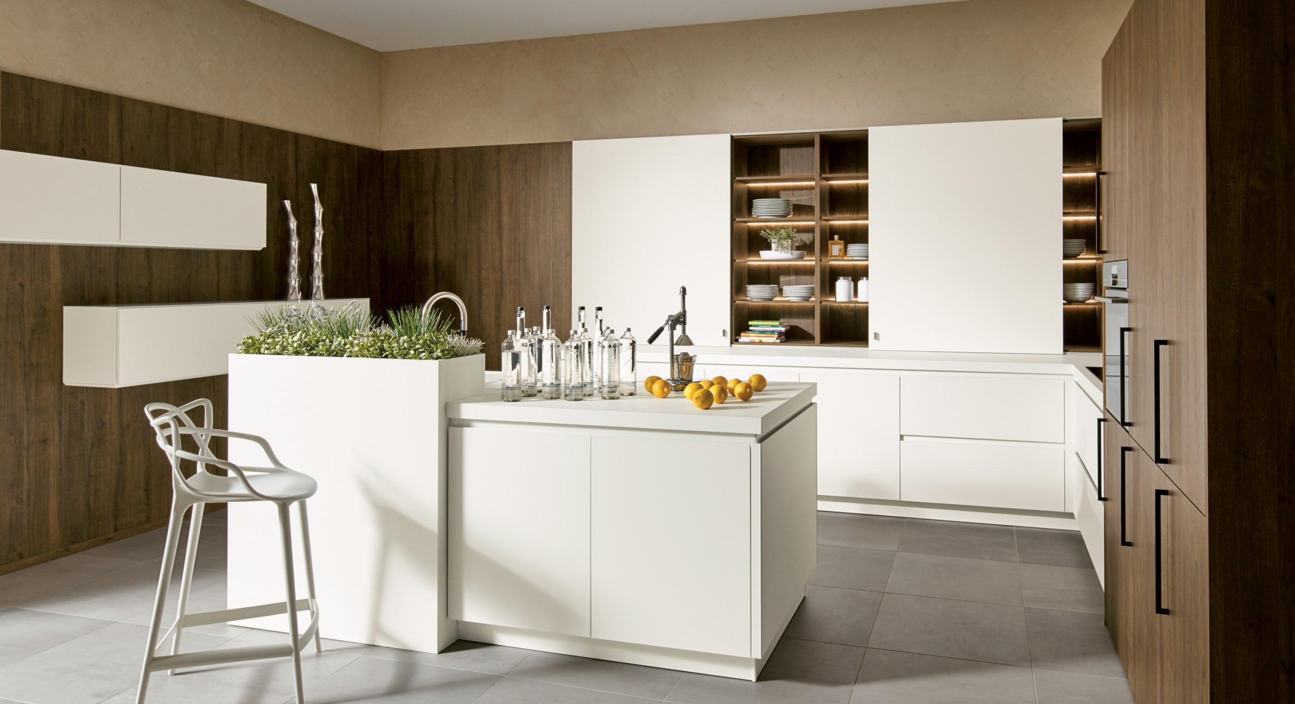 Handless contemporary kitchen with two tone doors finished in arctic white and oak brown